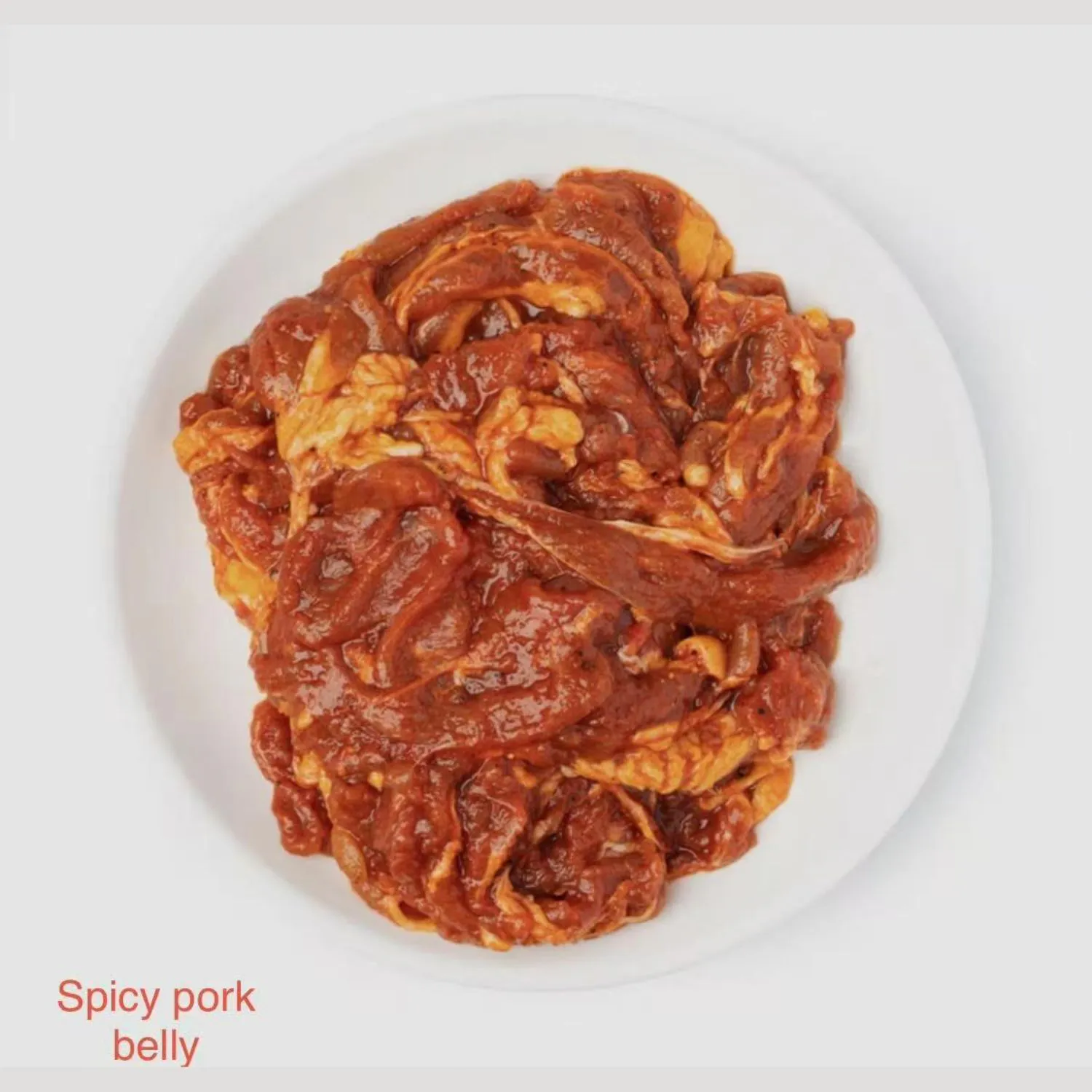 Marinated spicy pork belly at Shila Korean BBQ And Hot Pot, a Asian Fusion Restaurant in Oklahoma City