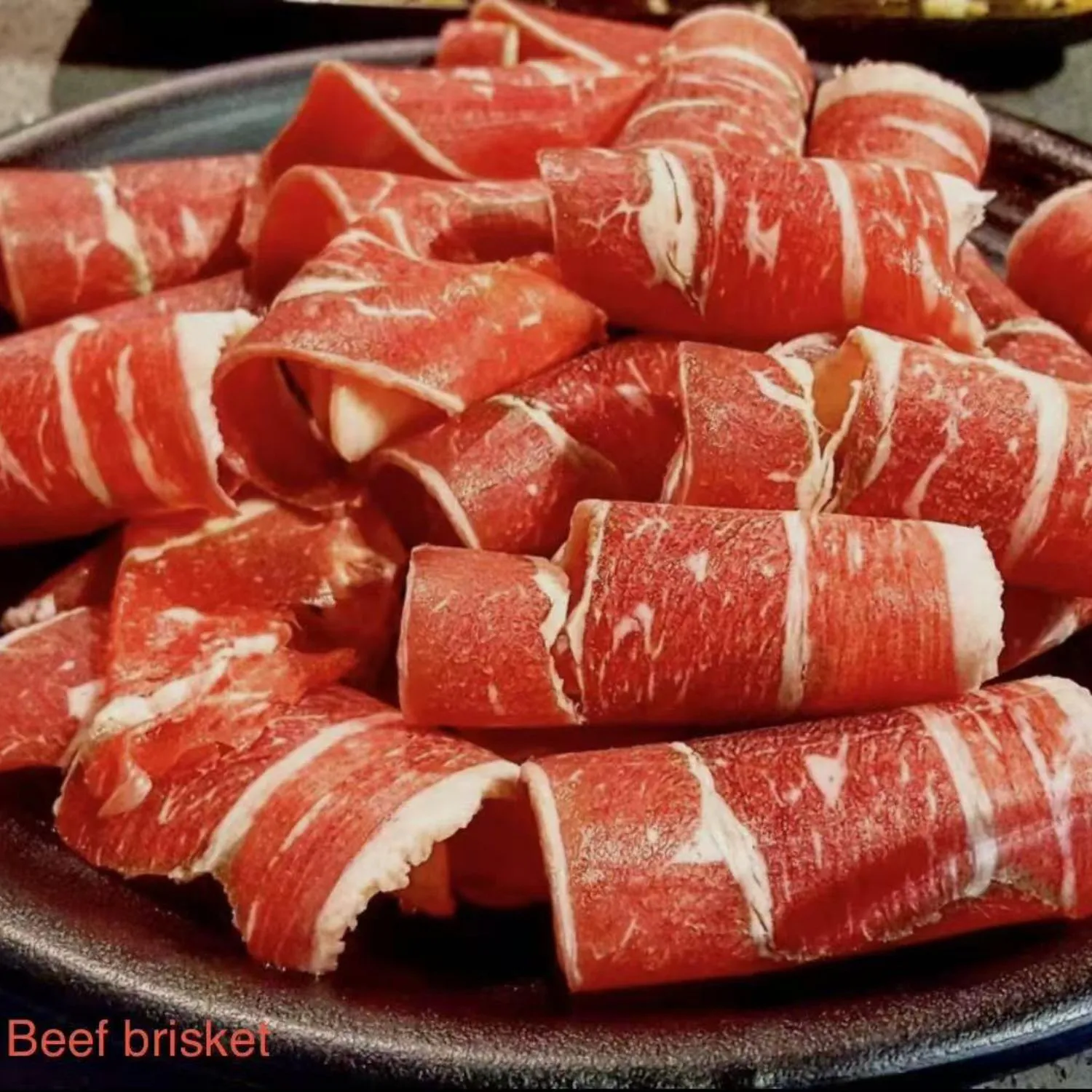 Thinly sliced beef brisket at Shila Korean BBQ And Hot Pot, a Asian Fusion Restaurant in Oklahoma City